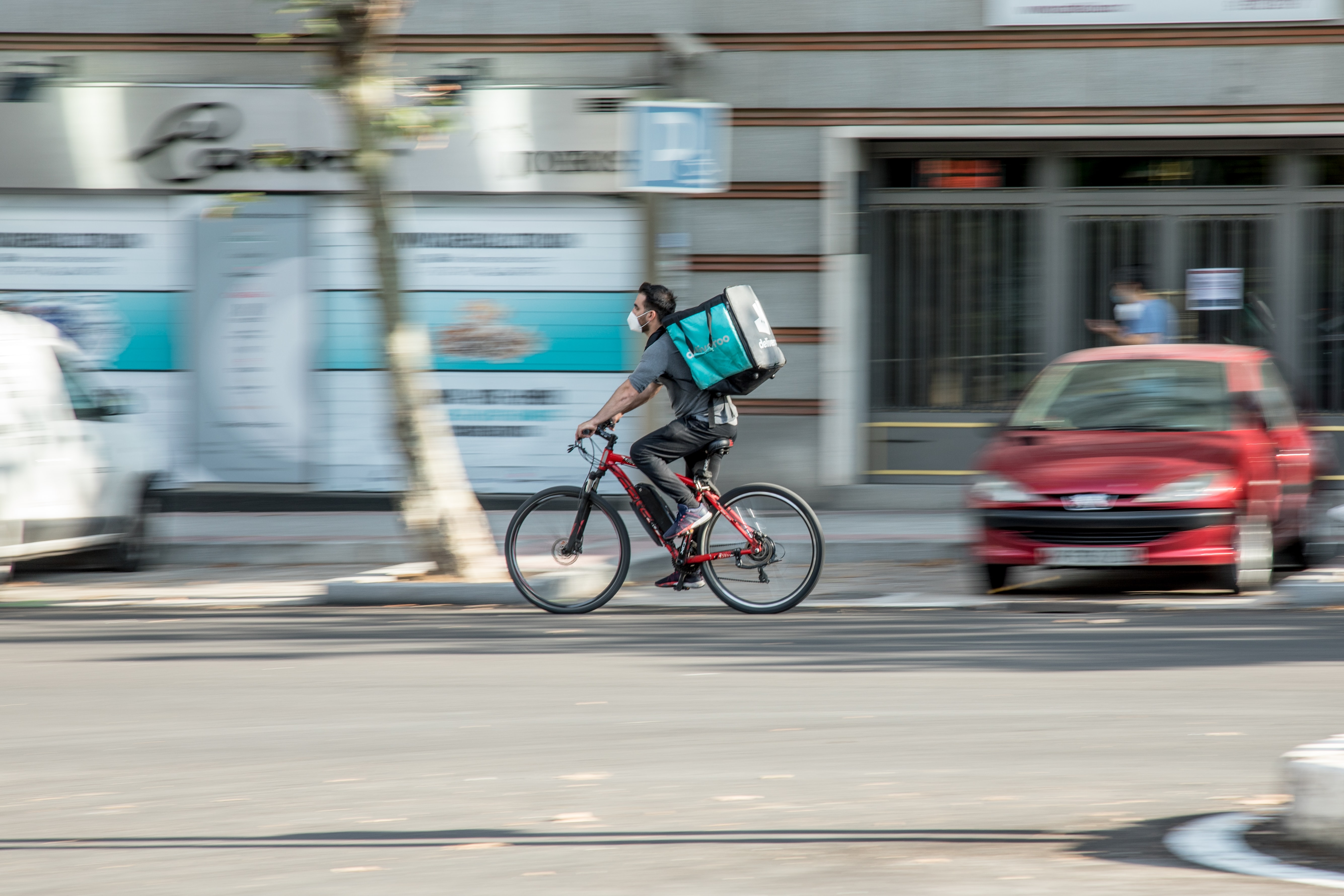 Food delivery worker riding a bike